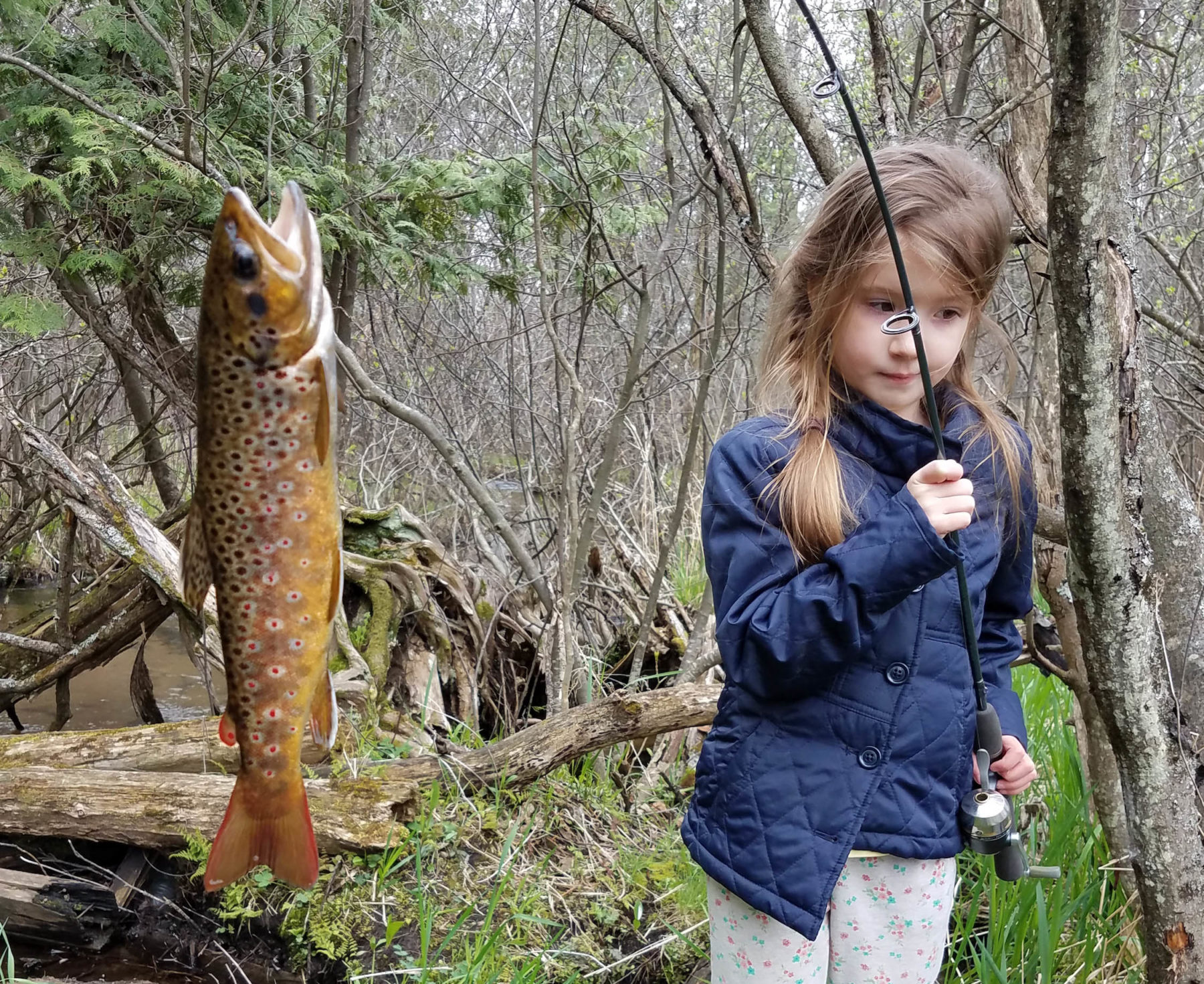 https://www.michiganoutofdoors.com/wp-content/uploads/2018/05/Girl-and-Trout-1-e1526308770199.jpg